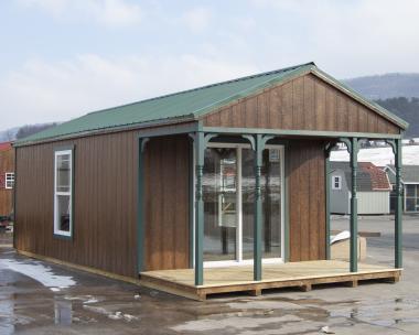 12x28 White Deer Cabin with front porch and patio doors at Pine Creek Structures of Spring Glen, PA