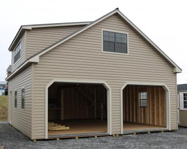 Pine Creek 24x28 Two Story Cape Cod Garage with Artisan Clay walls, Warm Sandalwood trim and Bronze shutters, and Burnish Slate metal roof