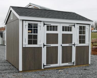 Pine Creek 10x12 HD New England Peak with Driftwood Polyurethane walls, White shutters White trim, and Charcoal shingles